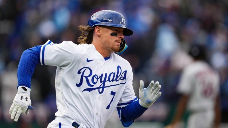 Apr 7, 2022; Kansas City, Missouri, USA; Kansas City Royals third baseman Bobby Witt Jr. (7) runs to first base after hitting a go-ahead RBI double during the eighth inning against the Cleveland Guardians at Kauffman Stadium. Mandatory Credit: Jay Biggerstaff-USA TODAY Sports