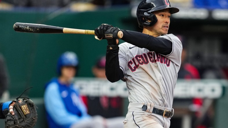 Apr 7, 2022; Kansas City, Missouri, USA; Cleveland Guardians right fielder Steven Kwan (67) hits a single for his first Major League hit during the ninth inning against the Kansas City Royals at Kauffman Stadium. Mandatory Credit: Jay Biggerstaff-USA TODAY Sports