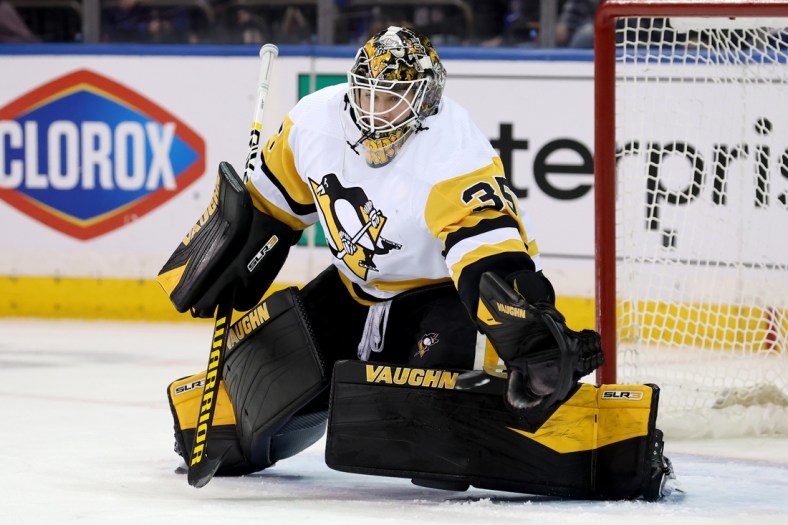 Apr 7, 2022; New York, New York, USA; Pittsburgh Penguins goaltender Tristan Jarry (35) makes a save against the New York Rangers during the first period at Madison Square Garden. Mandatory Credit: Brad Penner-USA TODAY Sports
