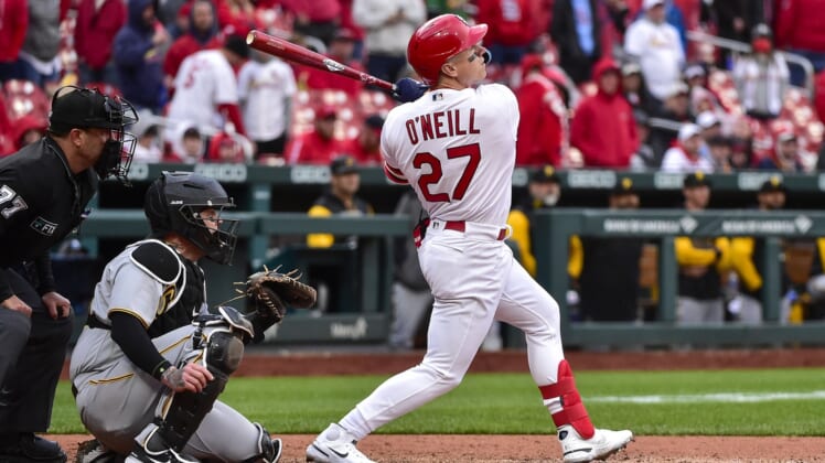 Apr 7, 2022; St. Louis, Missouri, USA;  St. Louis Cardinals left fielder Tyler O'Neill (27) hits a one run sacrifice fly against the Pittsburgh Pirates during the eighth inning of Opening Day at Busch Stadium. Mandatory Credit: Jeff Curry-USA TODAY Sports