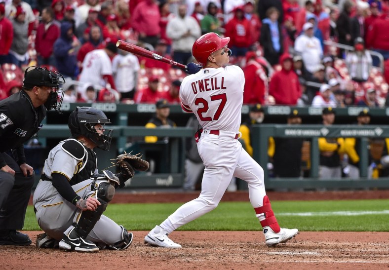 Apr 7, 2022; St. Louis, Missouri, USA;  St. Louis Cardinals left fielder Tyler O'Neill (27) hits a one run sacrifice fly against the Pittsburgh Pirates during the eighth inning of Opening Day at Busch Stadium. Mandatory Credit: Jeff Curry-USA TODAY Sports