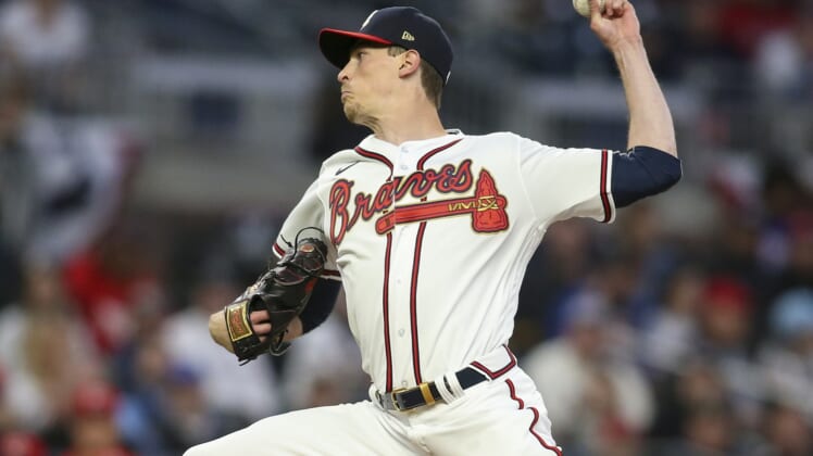 Apr 7, 2022; Atlanta, Georgia, USA; Atlanta Braves starting pitcher Max Fried (54) throws a pitch against the Cincinnati Reds in the first inning on Opening Day at Truist Park. Mandatory Credit: Brett Davis-USA TODAY Sports