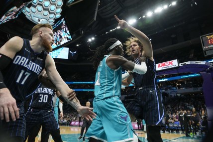 Apr 7, 2022; Charlotte, North Carolina, USA; Charlotte Hornets center Montrezl Harrell (8) tries to clear Orlando Magic center Robin Lopez (right) from an altercation that would later see both players ejected, as well as Magic forward Admiral Schofield (not pictured) during the second half at Spectrum Center. Mandatory Credit: Jim Dedmon-USA TODAY Sports