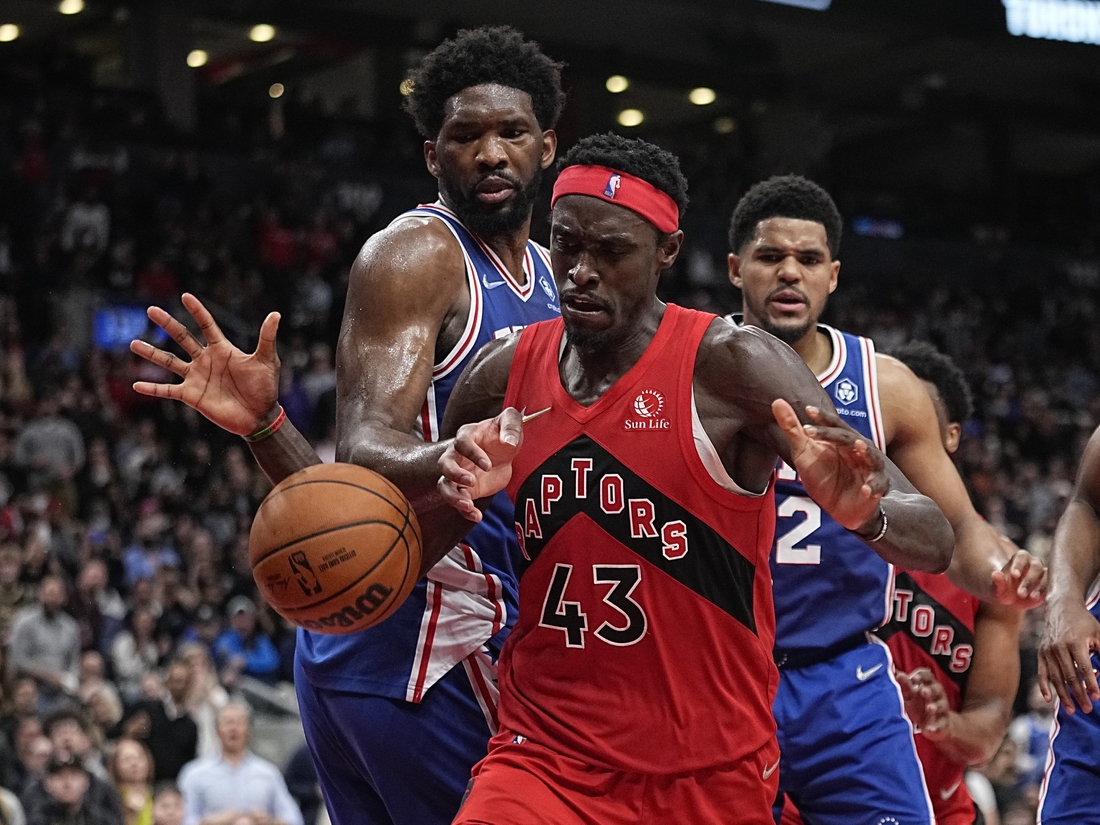 Apr 7, 2022; Toronto, Ontario, CAN; Philadelphia 76ers center Joel Embiid (21) knocks the ball away from Toronto Raptors forward Pascal Siakam (43) during the second half at Scotiabank Arena. Mandatory Credit: John E. Sokolowski-USA TODAY Sports