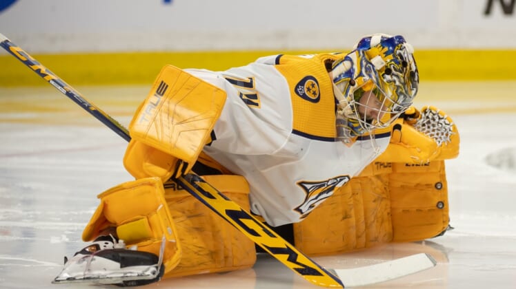 Apr 7, 2022; Ottawa, Ontario, CAN; Nashville Predators goalie Juuse Saros (74) stretches prior to the start of the second period against the Ottawa Senators at the Canadian Tire Centre. Mandatory Credit: Marc DesRosiers-USA TODAY Sports