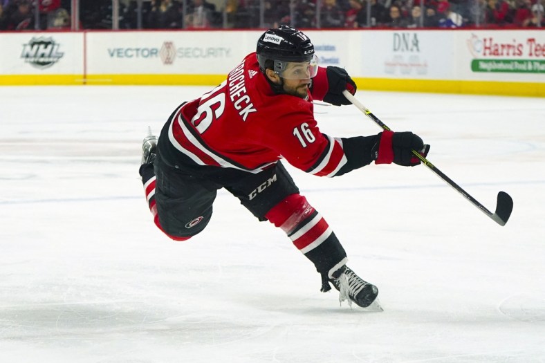 Apr 7, 2022; Raleigh, North Carolina, USA;  Carolina Hurricanes center Vincent Trocheck (16) takes a shot against the Buffalo Sabres during the first period at PNC Arena. Mandatory Credit: James Guillory-USA TODAY Sports