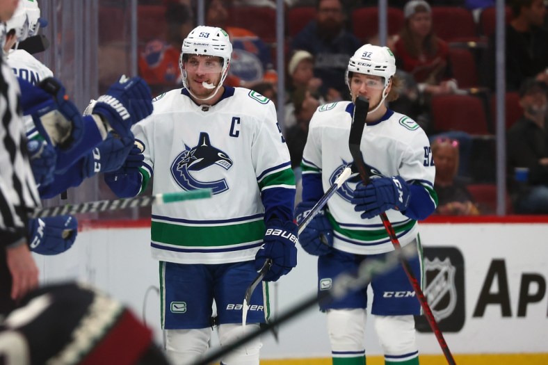 Apr 7, 2022; Glendale, Arizona, USA; Vancouver Canucks center Bo Horvat (53) celebrates his second goal of the game scored against the Arizona Coyotes during the second period at Gila River Arena. Mandatory Credit: Mark J. Rebilas-USA TODAY Sports