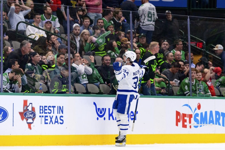 Apr 7, 2022; Dallas, Texas, USA; Toronto Maple Leafs center Auston Matthews (34) celebrates scoring the game winning goal against the Dallas Stars during the overtime period at the American Airlines Center. Mandatory Credit: Jerome Miron-USA TODAY Sports