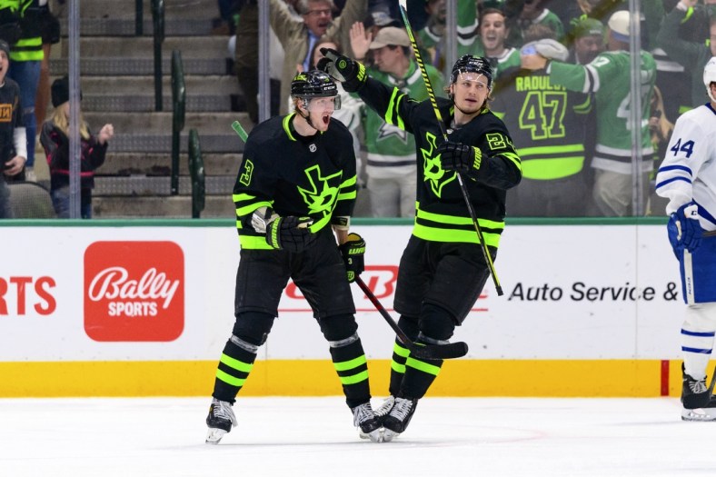 Apr 7, 2022; Dallas, Texas, USA; Dallas Stars defenseman John Klingberg (3) and center Roope Hintz (24) celebrates a goal scored by Klingberg against the Toronto Maple Leafs during the third period at the American Airlines Center. Mandatory Credit: Jerome Miron-USA TODAY Sports