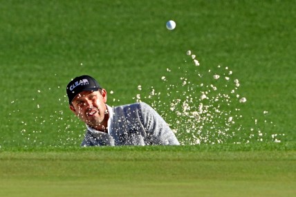 Apr 8, 2022; Augusta, Georgia, USA; Charl Schwartzel plays a shot from a bunker on the second hole during the second round of The Masters golf tournament. Mandatory Credit: Kyle Terada-USA TODAY Sports