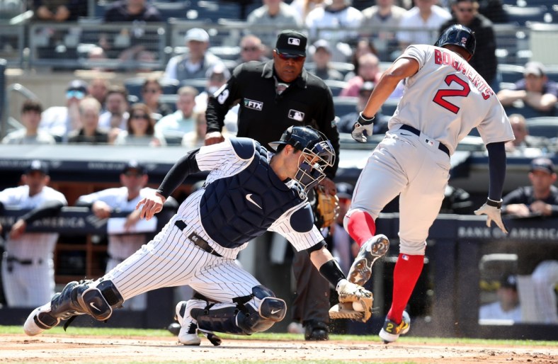 Yankee catcher Kyle Higashioka is a little late on the tag of Red Sox Xander Bogaert as he scores on an rbi single by teammate J.D. Martinez during opening day action at Yankee Stadium April 8, 2022.

Yankees Opening Day