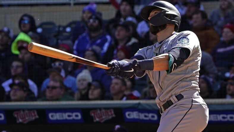 Apr 8, 2022; Minneapolis, Minnesota, USA;  Seattle Mariners right fielder Mitch Haniger (17) hits a two-run home run off of Minnesota Twins starting pitcher Joe Ryan (41) during the first inning at Target Field. Mandatory Credit: Nick Wosika-USA TODAY Sports