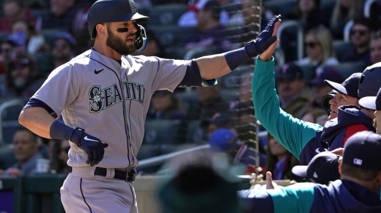 Apr 8, 2022; Minneapolis, Minnesota, USA;  Seattle Mariners right fielder Mitch Haniger (17) celebrates his two-run home run off of Minnesota Twins starting pitcher Joe Ryan (41) with his teammates during the first inning at Target Field. Mandatory Credit: Nick Wosika-USA TODAY Sports