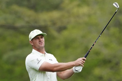 Apr 8, 2022; Augusta, Georgia, USA; Bryson DeChambeau tees off on no. 12 during the second round of The Masters golf tournament at Augusta National Golf Course. Mandatory Credit: Danielle Parhizkaran-Augusta Chronicle/USA TODAY Sports