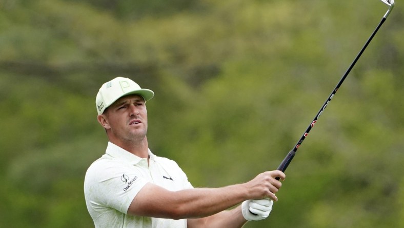 Apr 8, 2022; Augusta, Georgia, USA; Bryson DeChambeau tees off on no. 12 during the second round of The Masters golf tournament at Augusta National Golf Course. Mandatory Credit: Danielle Parhizkaran-Augusta Chronicle/USA TODAY Sports