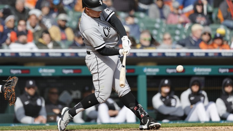 Apr 8, 2022; Detroit, Michigan, USA;  Chicago White Sox designated hitter Andrew Vaughn (25) hits a home run in the ninth inning against the Detroit Tigers at Comerica Park. Mandatory Credit: Rick Osentoski-USA TODAY Sports