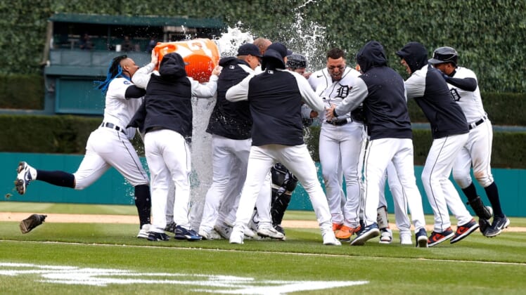 Detroit Tigers teammates celebrate with Javier Baez, center facing, after he hit a single in the ninth inning that won the Opening Day game 5-4 over the Chicago White Sox at Comerica Park on Friday, April 8, 2022.Openingday 040822 Es21