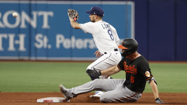 Apr 8, 2022; St. Petersburg, Florida, USA;Baltimore Orioles first baseman Ryan Mountcastle (6) doubles as he slides  into second base during the eighth inning and Tampa Bay Rays second baseman Brandon Lowe (8) attempted to tag him out at Tropicana Field. Mandatory Credit: Kim Klement-USA TODAY Sports