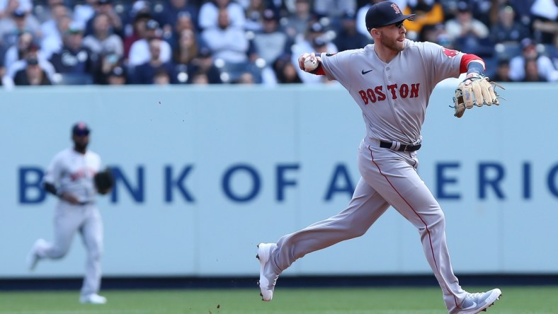 Apr 8, 2022; Bronx, New York, USA; Boston Red Sox second baseman Trevor Story (10) makes the throw to first for an out during the first inning against New York Yankees at Yankee Stadium. Mandatory Credit: Tom Horak-USA TODAY Sports