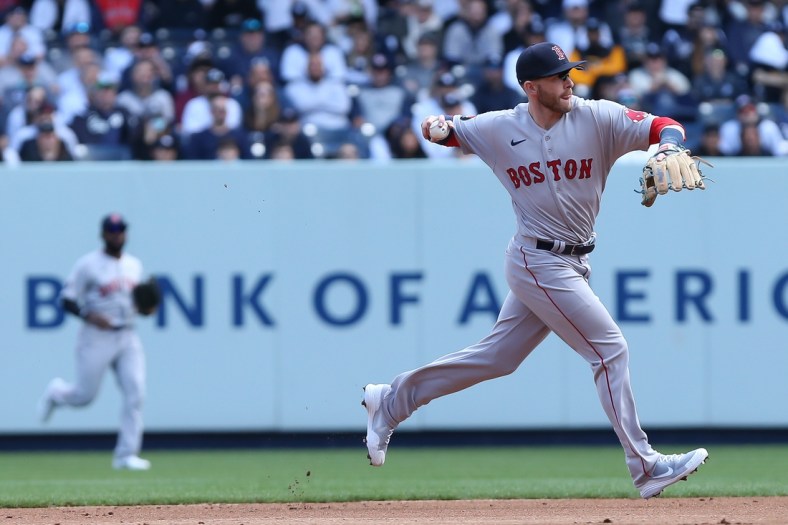 Apr 8, 2022; Bronx, New York, USA; Boston Red Sox second baseman Trevor Story (10) makes the throw to first for an out during the first inning against New York Yankees at Yankee Stadium. Mandatory Credit: Tom Horak-USA TODAY Sports