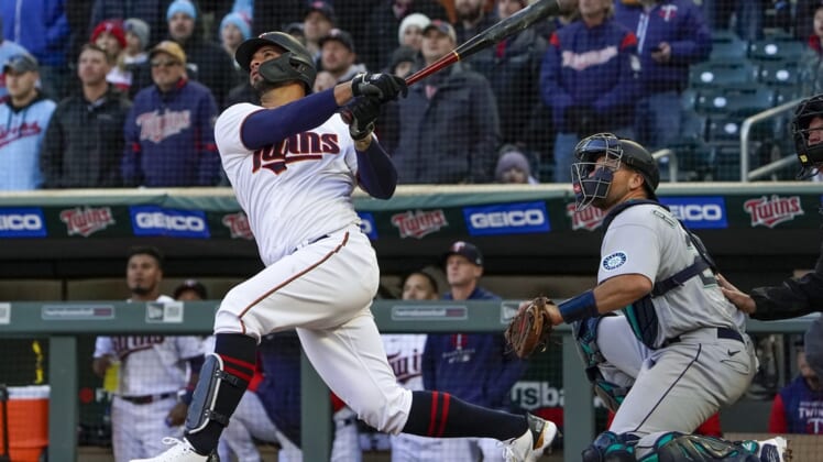 Apr 8, 2022; Minneapolis, Minnesota, USA;  Minnesota Twins designated hitter Gary Sanchez (24) pops out to Seattle Mariners left fielder Jesse Winker (27) during the ninth inning to end the game at Target Field. Mandatory Credit: Nick Wosika-USA TODAY Sports