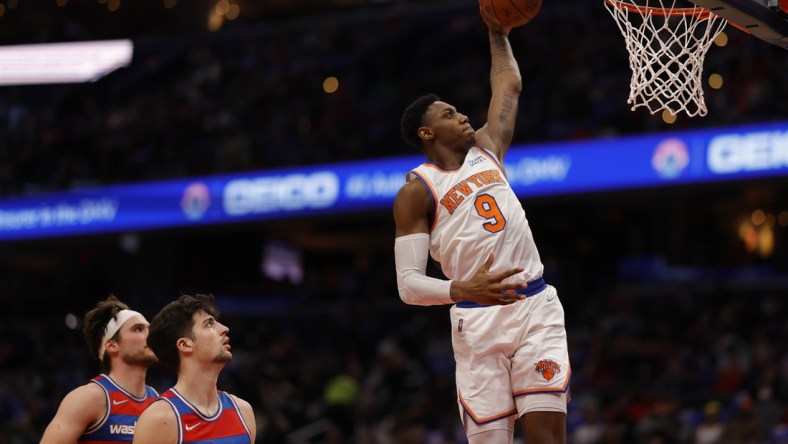 Apr 8, 2022; Washington, District of Columbia, USA; New York Knicks guard RJ Barrett (9) dunks the ball as Washington Wizards forward Deni Avdija (9) looks on in the second quarter at Capital One Arena. Mandatory Credit: Geoff Burke-USA TODAY Sports