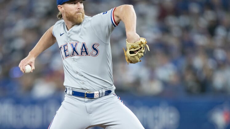 Apr 8, 2022; Toronto, Ontario, CAN; Texas Rangers starting pitcher Jon Gray (22) throws a pitch during the first inning against the Toronto Blue Jays at Rogers Centre . Mandatory Credit: Nick Turchiaro-USA TODAY Sports