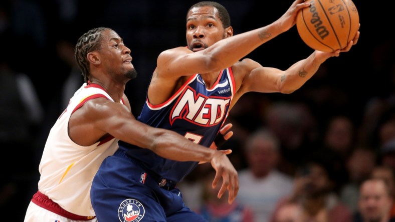 Apr 8, 2022; Brooklyn, New York, USA; Brooklyn Nets forward Kevin Durant (7) controls the ball against Cleveland Cavaliers guard Caris LeVert (3) during the first quarter at Barclays Center. Mandatory Credit: Brad Penner-USA TODAY Sports