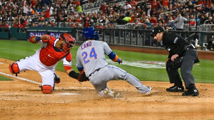 Apr 8, 2022; Washington, District of Columbia, USA;  Washington Nationals catcher Keibert Ruiz (20) tags New York Mets second baseman Robinson Cano (24) out at the plate to end the fourth inning at Nationals Park. Mandatory Credit: Tommy Gilligan-USA TODAY Sports