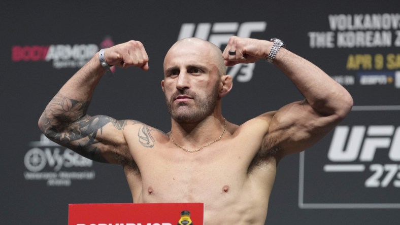 Apr 8, 2022; Jacksonville, FL, USA; Alexander Volkanovski on the scale during weigh ins for UFC 273 at VyStar Veterans Memorial Stadium. Mandatory Credit: David Yeazell-USA TODAY Sports