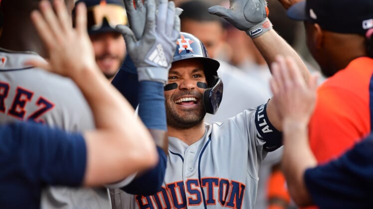 Apr 8, 2022; Anaheim, California, USA; Houston Astros second baseman Jose Altuve (27) celebrates his solo home run hit against the Los Angeles Angels during the first inning at Angel Stadium. Mandatory Credit: Gary A. Vasquez-USA TODAY Sports