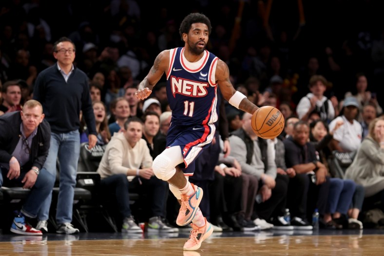 Apr 8, 2022; Brooklyn, New York, USA; Brooklyn Nets guard Kyrie Irving (11) brings the ball up court against the Cleveland Cavaliers during the fourth quarter at Barclays Center. Mandatory Credit: Brad Penner-USA TODAY Sports