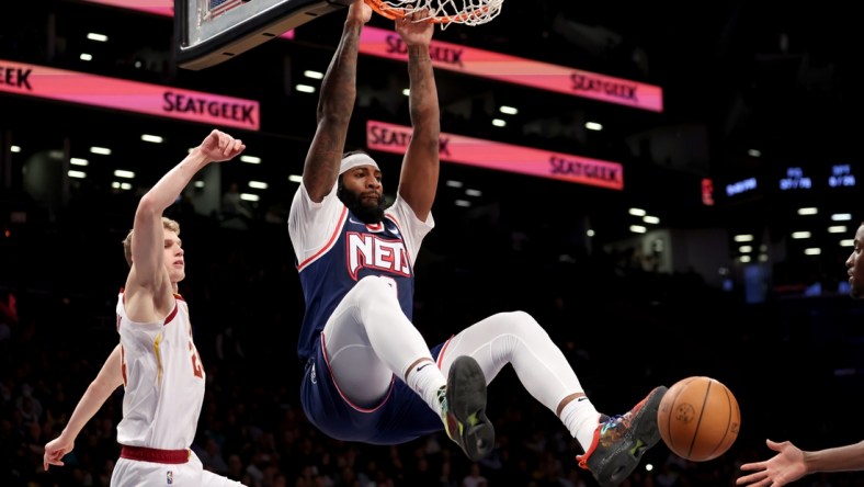 Apr 8, 2022; Brooklyn, New York, USA; Brooklyn Nets center Andre Drummond (0) dunks against Cleveland Cavaliers forward Lauri Markkanen (24) during the fourth quarter at Barclays Center. Mandatory Credit: Brad Penner-USA TODAY Sports