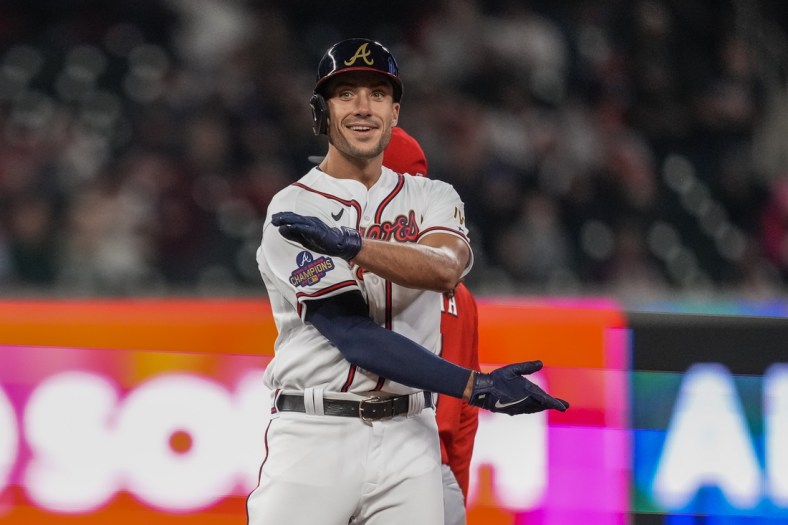 Apr 8, 2022; Cumberland, Georgia, USA; Atlanta Braves first baseman Matt Olson (28) reacts after hitting a double against the Cincinnati Reds during the sixth inning at Truist Park. Mandatory Credit: Dale Zanine-USA TODAY Sports