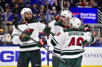 Apr 8, 2022; St. Louis, Missouri, USA;  Minnesota Wild defenseman Jacob Middleton (5) celebrates with defenseman Jared Spurgeon (46) and left wing Jordan Greenway (18) after scoring against the St. Louis Blues during the third period at Enterprise Center. Mandatory Credit: Jeff Curry-USA TODAY Sports