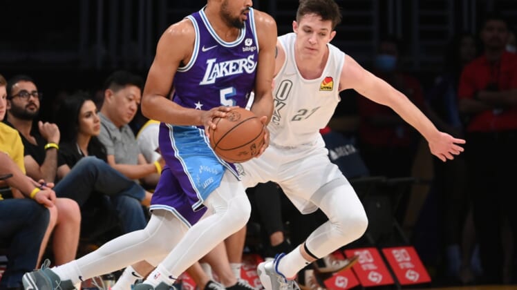 Apr 8, 2022; Los Angeles, California, USA; Los Angeles Lakers guard Talen Horton-Tucker (5) is defended by Oklahoma City Thunder guard Vit Krejci (27) as he drives to the basket in the first half at Crypto.com Arena. Mandatory Credit: Jayne Kamin-Oncea-USA TODAY Sports