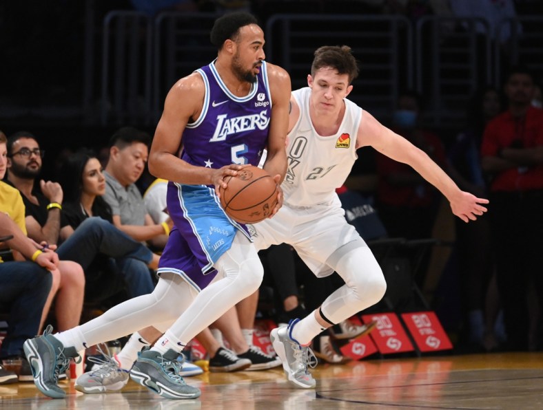 Apr 8, 2022; Los Angeles, California, USA; Los Angeles Lakers guard Talen Horton-Tucker (5) is defended by Oklahoma City Thunder guard Vit Krejci (27) as he drives to the basket in the first half at Crypto.com Arena. Mandatory Credit: Jayne Kamin-Oncea-USA TODAY Sports