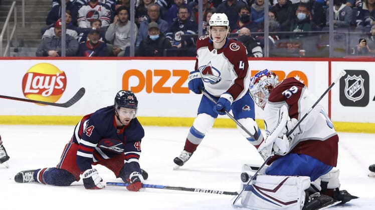 Apr 8, 2022; Winnipeg, Manitoba, CAN; Colorado Avalanche goaltender Pavel Francouz (39) stops a shot by Winnipeg Jets defenseman Josh Morrissey (44) in the second period at Canada Life Centre. Mandatory Credit: James Carey Lauder-USA TODAY Sports