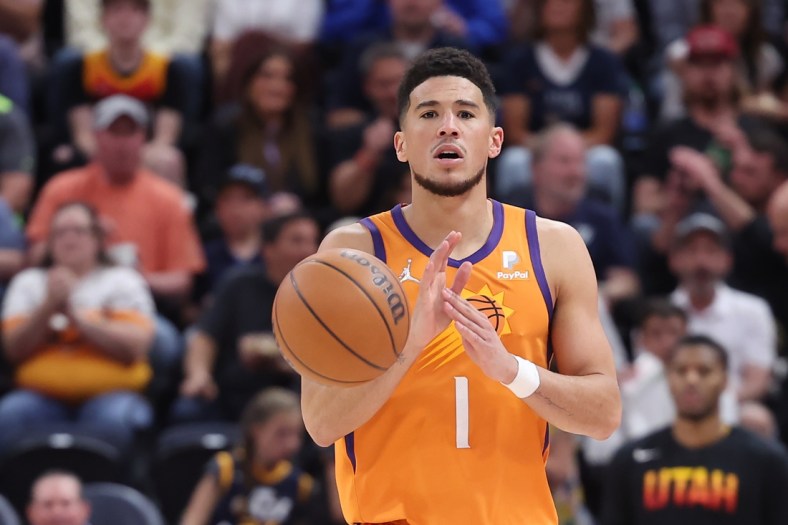 Apr 8, 2022; Salt Lake City, Utah, USA; Phoenix Suns guard Devin Booker (1) calls out a play while brings the ball up the court in the third quarter against the Utah Jazz at Vivint Arena. Mandatory Credit: Rob Gray-USA TODAY Sports