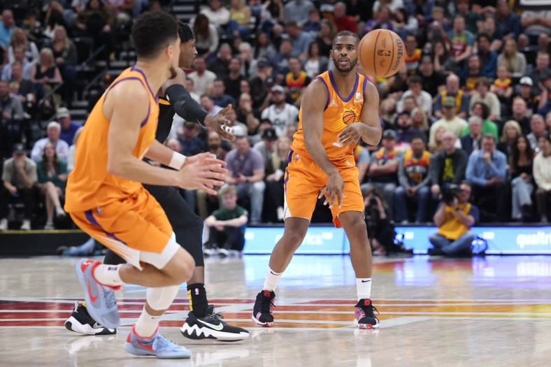 Apr 8, 2022; Salt Lake City, Utah, USA; Phoenix Suns guard Chris Paul (3) passes the ball to Phoenix Suns guard Devin Booker (1) in the fourth quarter against the Utah Jazz at Vivint Arena. Mandatory Credit: Rob Gray-USA TODAY Sports