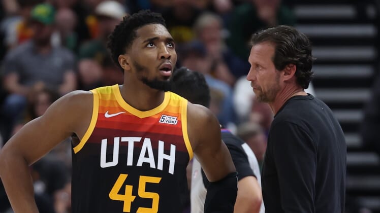Apr 8, 2022; Salt Lake City, Utah, USA; Utah Jazz guard Donovan Mitchell (45) speaks with head coach Quin Snyder during a fourth quarter break in action against the Phoenix Suns at Vivint Arena. Mandatory Credit: Rob Gray-USA TODAY Sports