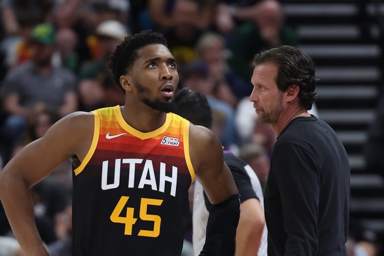 Apr 8, 2022; Salt Lake City, Utah, USA; Utah Jazz guard Donovan Mitchell (45) speaks with head coach Quin Snyder during a fourth quarter break in action against the Phoenix Suns at Vivint Arena. Mandatory Credit: Rob Gray-USA TODAY Sports