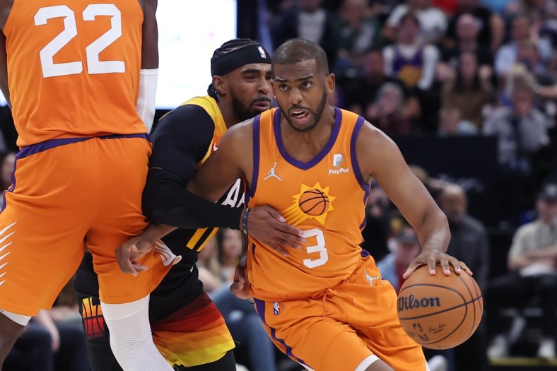 Apr 8, 2022; Salt Lake City, Utah, USA; Phoenix Suns guard Chris Paul (3) uses a screen to get past Utah Jazz guard Mike Conley (11) in the fourth quarter at Vivint Arena. Mandatory Credit: Rob Gray-USA TODAY Sports
