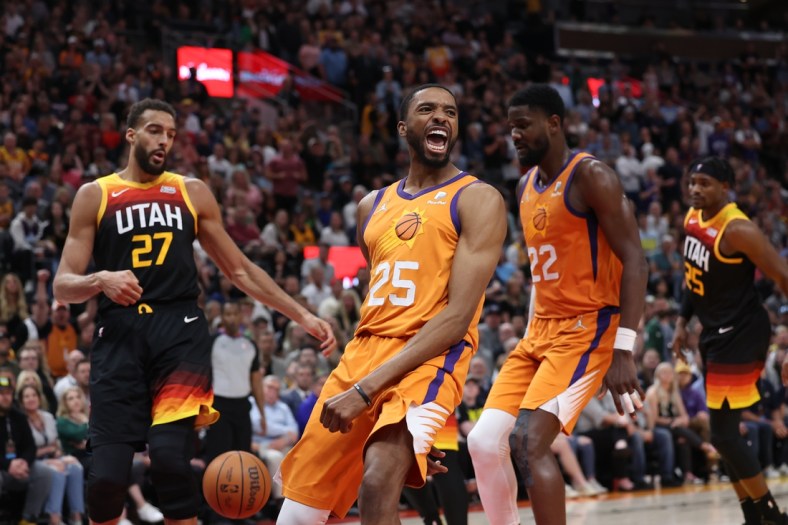Apr 8, 2022; Salt Lake City, Utah, USA; Phoenix Suns forward Mikal Bridges (25) reacts to dunking the ball in the fourth quarter against the Utah Jazz at Vivint Arena. Mandatory Credit: Rob Gray-USA TODAY Sports