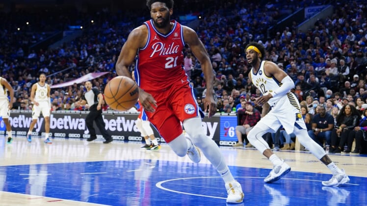 Apr 9, 2022; Philadelphia, Pennsylvania, USA; Philadelphia 76ers center Joel Embiid (21) chases a loose ball against the Indiana Pacers during the first half at Wells Fargo Center. Mandatory Credit: Gregory Fisher-USA TODAY Sports