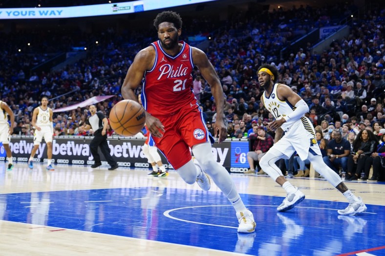 Apr 9, 2022; Philadelphia, Pennsylvania, USA; Philadelphia 76ers center Joel Embiid (21) chases a loose ball against the Indiana Pacers during the first half at Wells Fargo Center. Mandatory Credit: Gregory Fisher-USA TODAY Sports