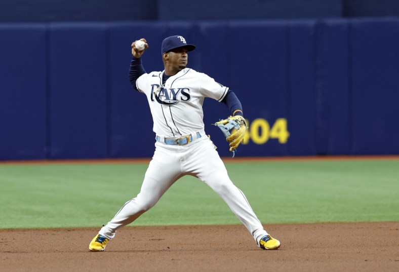 Apr 9, 2022; St. Petersburg, Florida, USA; Tampa Bay Rays shortstop Wander Franco (5) throws the ball to first base for an out during the first inning against the Baltimore Orioles at Tropicana Field. Mandatory Credit: Kim Klement-USA TODAY Sports