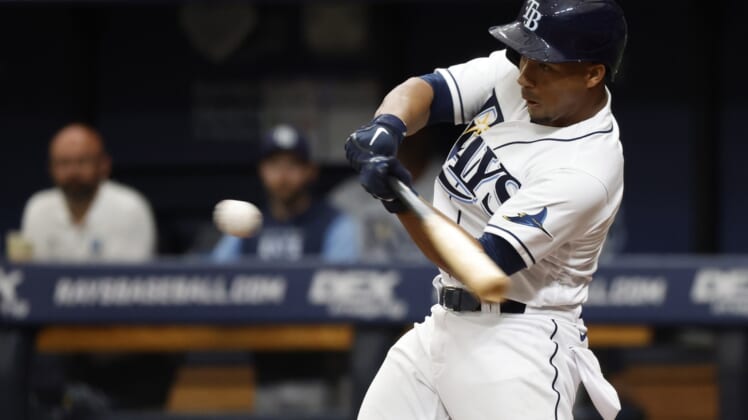 Apr 9, 2022; St. Petersburg, Florida, USA; Tampa Bay Rays catcher Francisco Mejia (21) hits a RBI single during the second inning against the Baltimore Orioles  at Tropicana Field. Mandatory Credit: Kim Klement-USA TODAY Sports