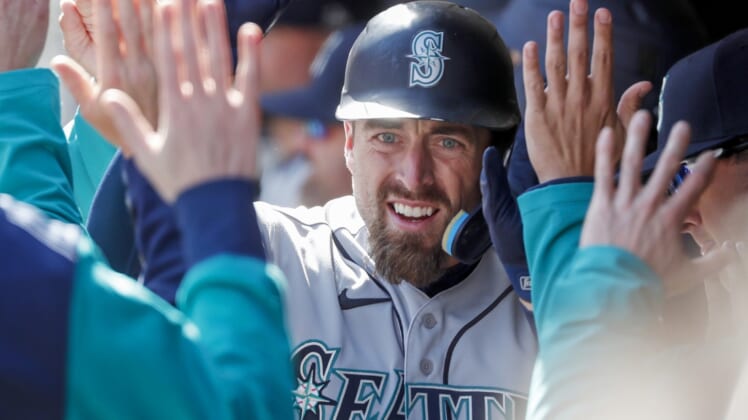 Apr 9, 2022; Minneapolis, Minnesota, USA; Seattle Mariners catcher Tom Murphy (2) celebrates his solo home run against the Minnesota Twins in the fifth inning at Target Field. Mandatory Credit: Bruce Kluckhohn-USA TODAY Sports