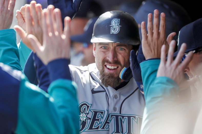 Apr 9, 2022; Minneapolis, Minnesota, USA; Seattle Mariners catcher Tom Murphy (2) celebrates his solo home run against the Minnesota Twins in the fifth inning at Target Field. Mandatory Credit: Bruce Kluckhohn-USA TODAY Sports